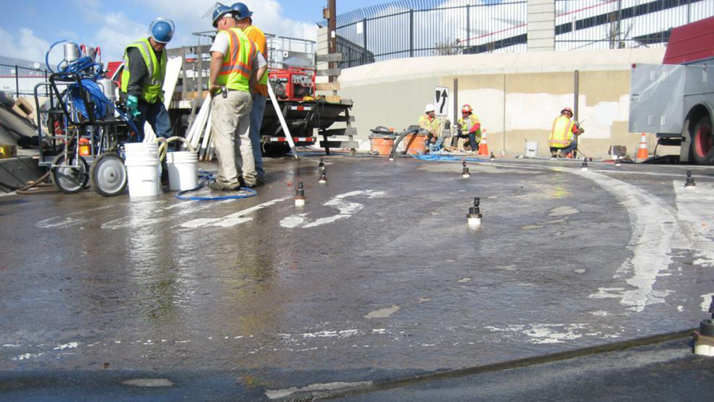 Custom made packers allowed crews to pump acrylamide grout beneath the slab.
